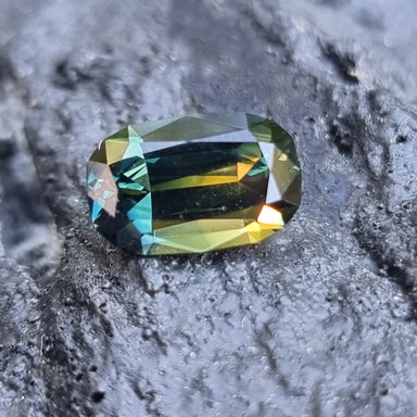 A cushion-cut parti sapphire with a Pharaoh’s Eye