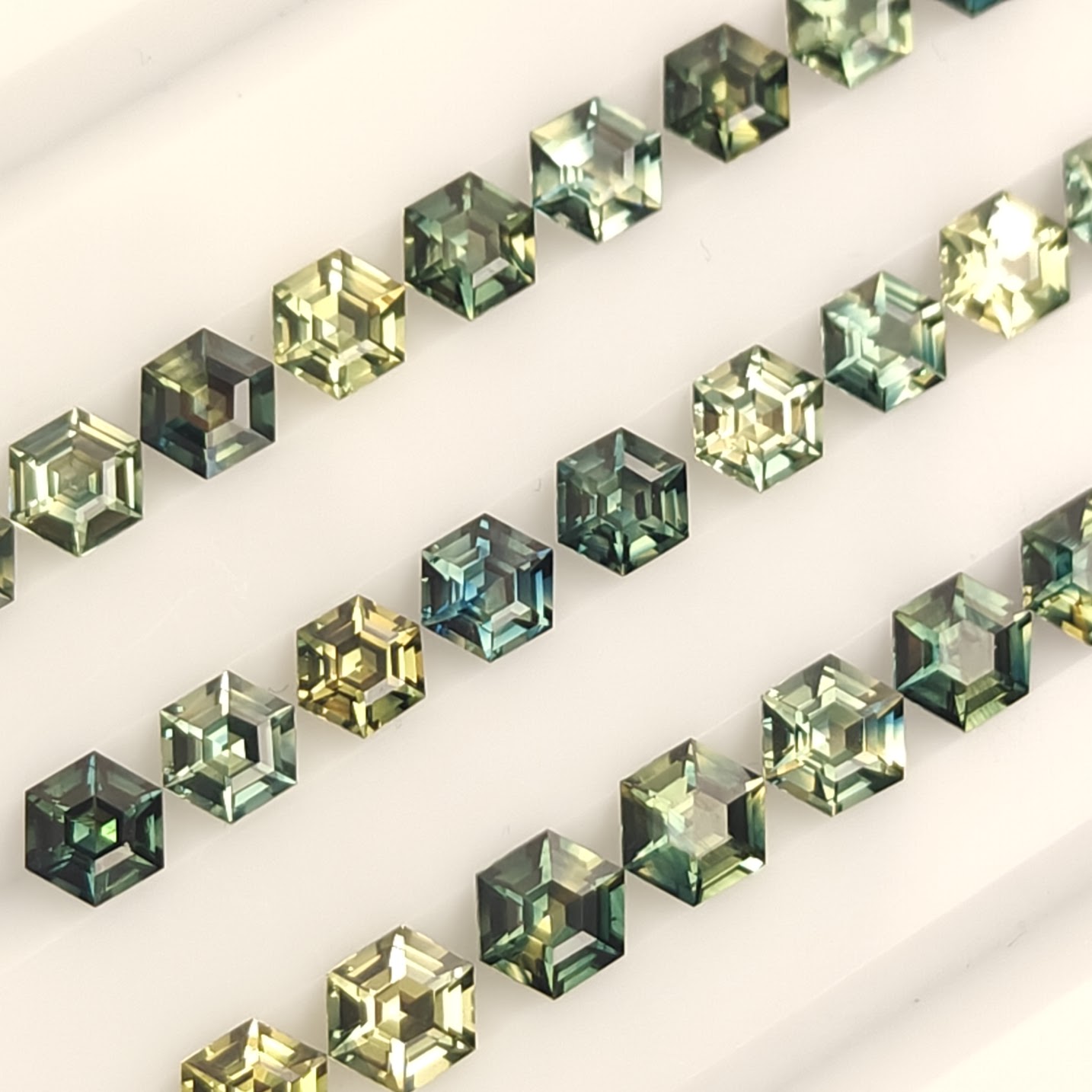 precision cut hexagon parti sapphires.